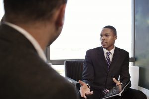 Businessmen Discussing In Office